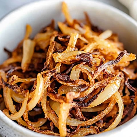 A bowl of fried onions.